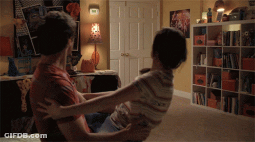 Man Holding Woman In Arms GIF