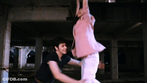 Man Holding Woman In Dark Room GIF