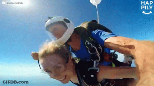 Man Holding Woman In The Air Happily GIF