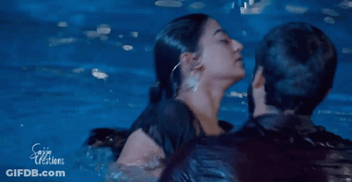 Man Holding Woman In Water GIF