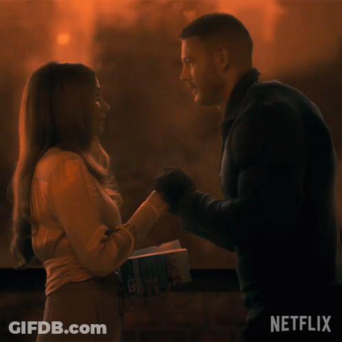 Man Holding Woman's Hand Netflix Sign GIF
