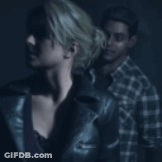 Man Holding Woman's Neck In Dark Room GIF