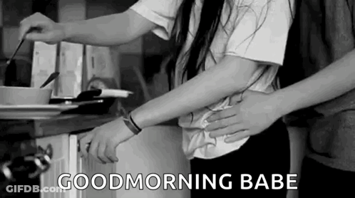 Man Holding Woman's Waist In Kitchen GIF