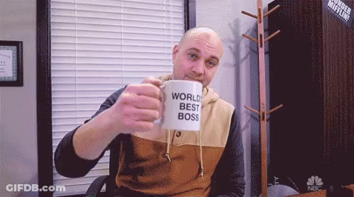Man Holding World's Best Boss Mug GIF