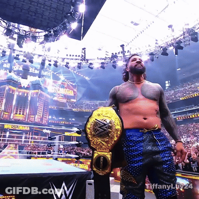 Man Holding Wrestling Championship Belt GIF