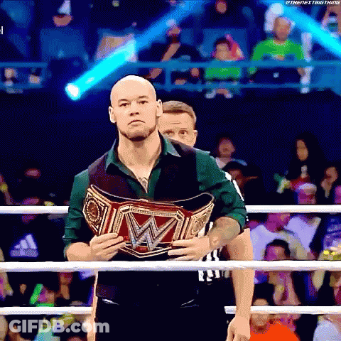 Man Holding Wrestling Championship Belt In Boxing Ring GIF