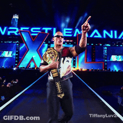 Man Holding Wrestling Championship Belt In Front Of Wrestlemania XL Sign GIF
