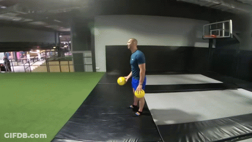 Man Holding Yellow Ball GIF
