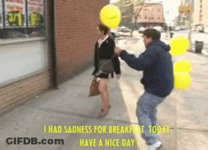 Man Holding Yellow Balloon Over Woman With Caption I Had Sadness For Breakfast Today GIF