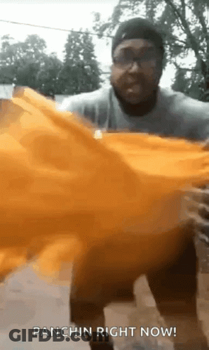 Man Holding Yellow Cloth Saying Panchin GIF