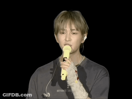 Man Holding Yellow Microphone Saying Return GIF