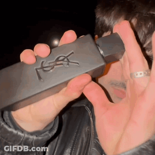 Man Holding YSL Perfume Bottle GIF
