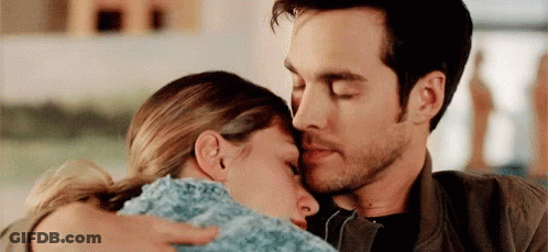 Man Hugging And Kissing Woman On Forehead GIF