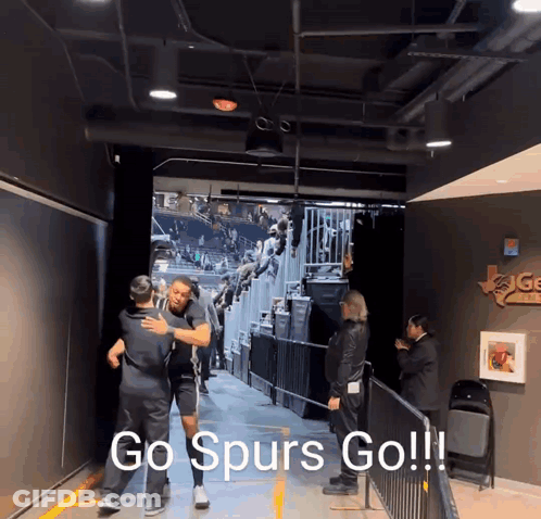 Man Hugging Another Man In Tunnel Go Spurs Go GIF