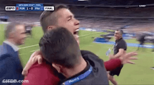 Man Hugging Another Man On Soccer Field GIF