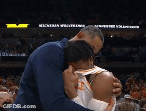 Man Hugging Basketball Player In Stadium GIF