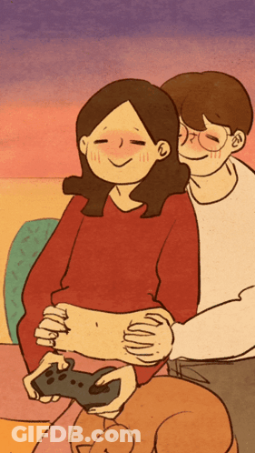 Man Hugging Woman Holding Controller GIF