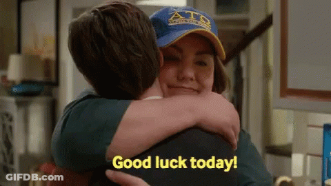 Man Hugging Woman In Blue Hat GIF