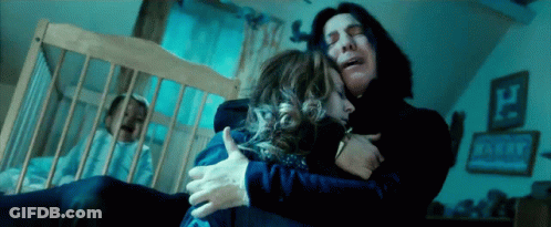 Man Hugging Woman In Dark Room GIF
