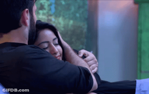 Man Hugging Woman On Bed GIF