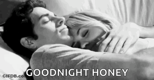 Man Hugging Woman Sleeping In Bed GIF