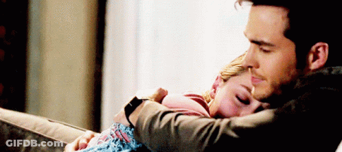 Man Hugging Woman Sleeping On Lap GIF