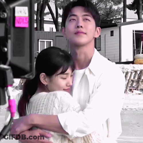 Man Hugging Woman With Noise Sign GIF