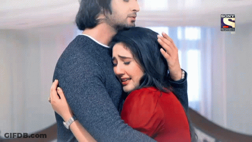 Man Hugging Woman With Sony Television Logo GIF