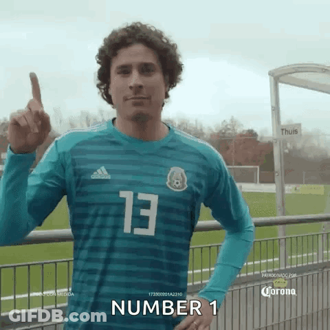Man In #13 Jersey Pointing Up GIF