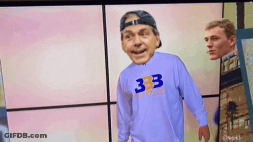 Man In 333 Shirt Stands In Front Of Another Man GIF