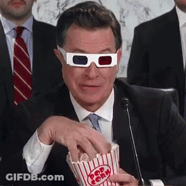 Man In 3D Glasses Eating Popcorn GIF