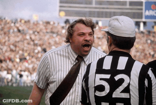 Man In 52 Shirt Talking To Another GIF