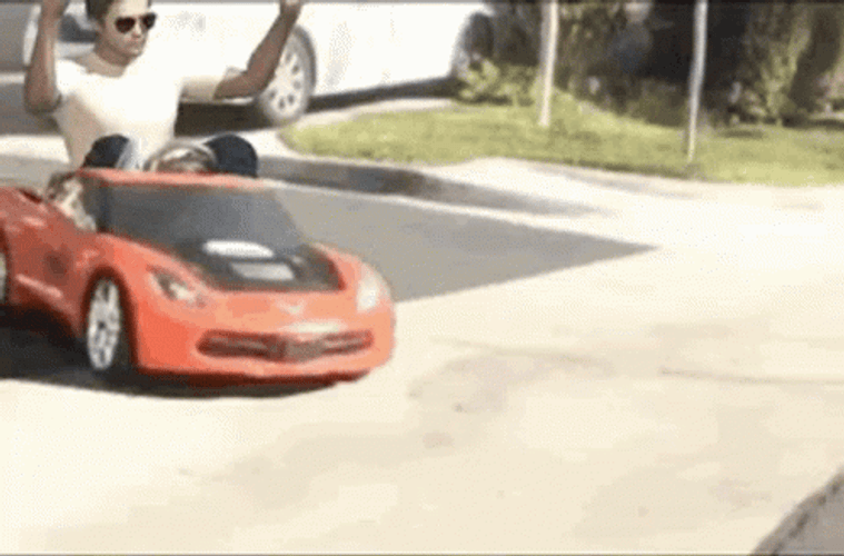 Man In A Kiddie Car Meme GIF