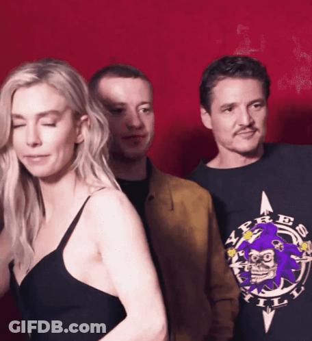Man In A.P.R.E. Shirt Next To Woman GIF