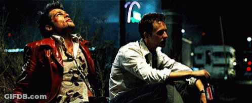 Man In 'A' Shirt In Dark Room GIF