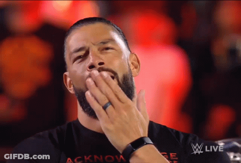 Man In Acknowlege Shirt Covering Mouth GIF