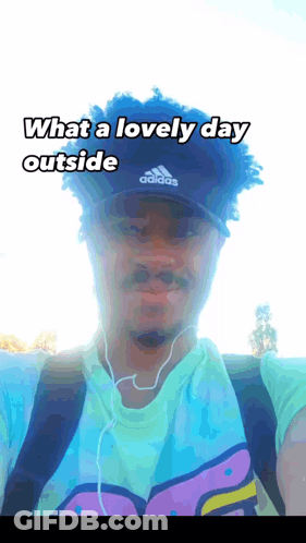 Man In Adidas Hat And Ear Buds GIF