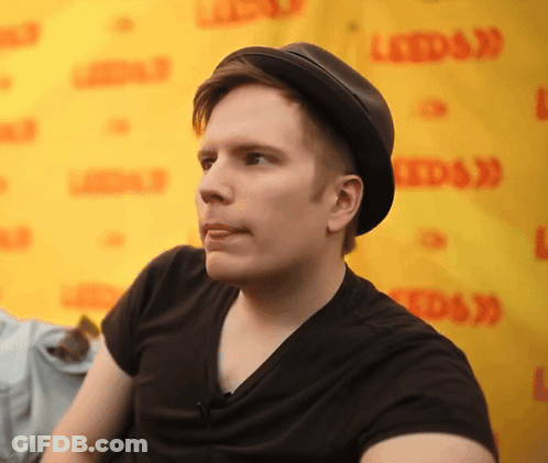 Man In Adidas Jacket In Front Of Boost Drinks Sign GIF