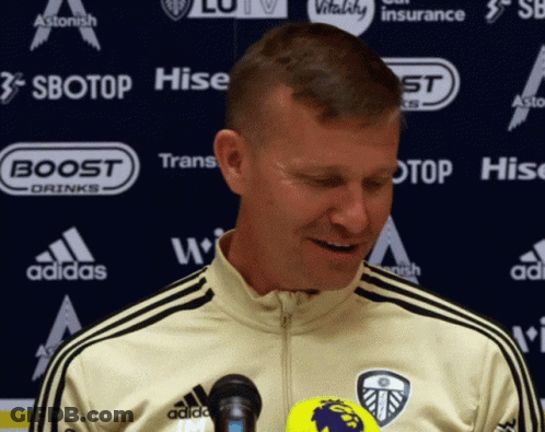 Man In Adidas Jacket In Front Of Sbotop And Hise Advertisement GIF