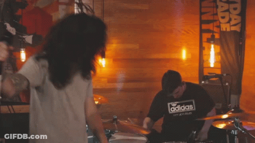 Man In Adidas Shirt Playing Drums GIF