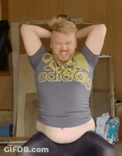 Man In Adidas Shirt Sitting With Hands On Head GIF
