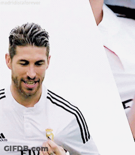 Man In Adidas Shirt Smiling Holding Something GIF