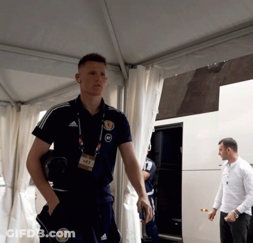Man In Adidas Shirt With Scotland Badge GIF