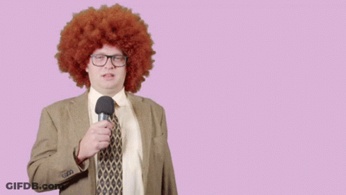 Man In Afro Wig Holding Microphone With Lets Check It Out Behind GIF