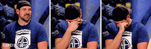 Man In Airborne Shirt Covering Face GIF