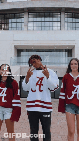 Man In Alabama Hockey Jersey With Two Women GIF
