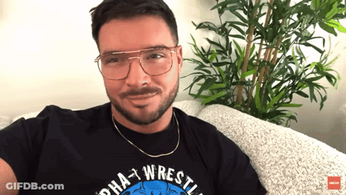 Man In Alpha Wrestling Shirt GIF