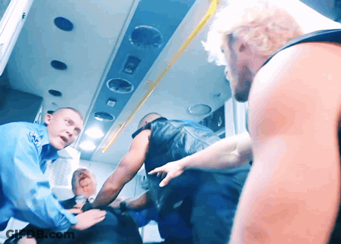 Man In Ambulance Helped By Paramedic GIF
