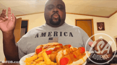Man In America Shirt Eating Hot Dog GIF