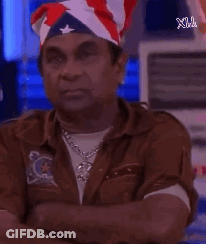 Man In American Flag Bandana Looking At Camera GIF